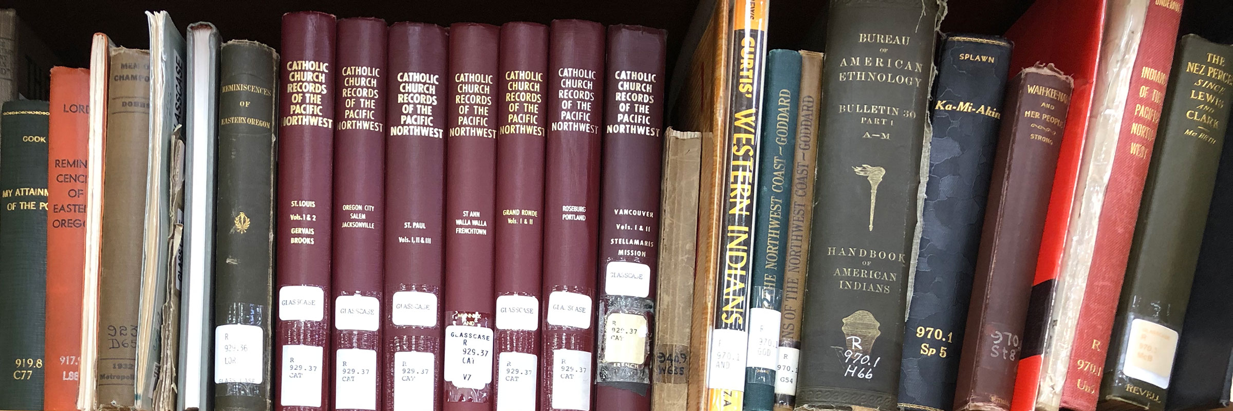 Shelf of books at The Dalles Local History and Genealogy section