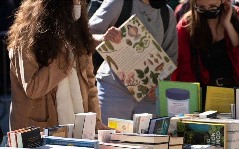 People browsing tables of books at Friends book sale